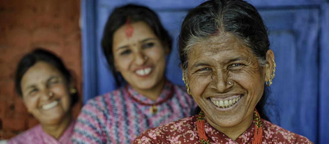 Three women smiling at the camera