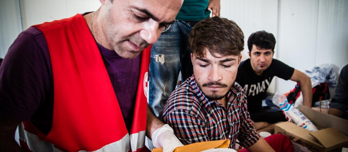 Men working together reading document