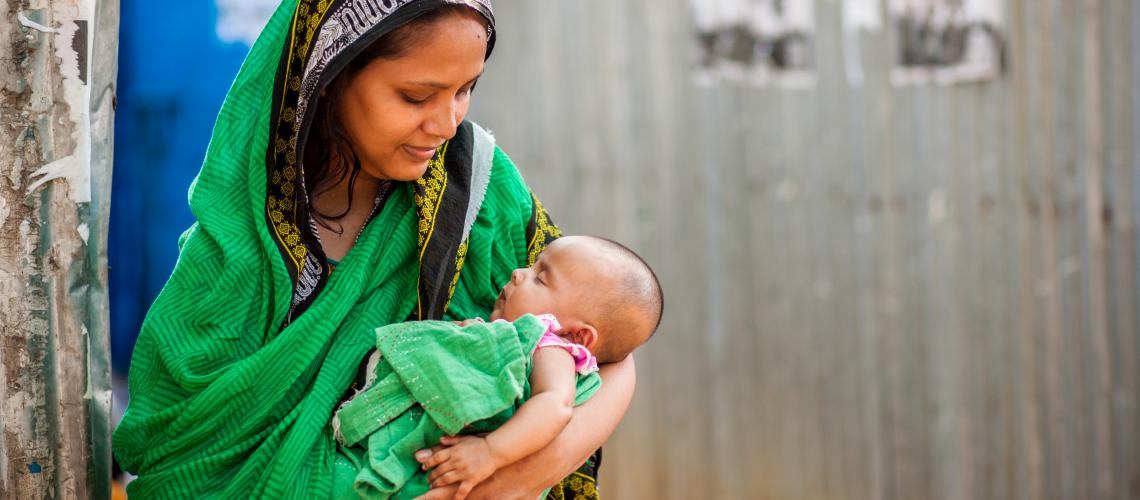 Woman holding a baby in her arms