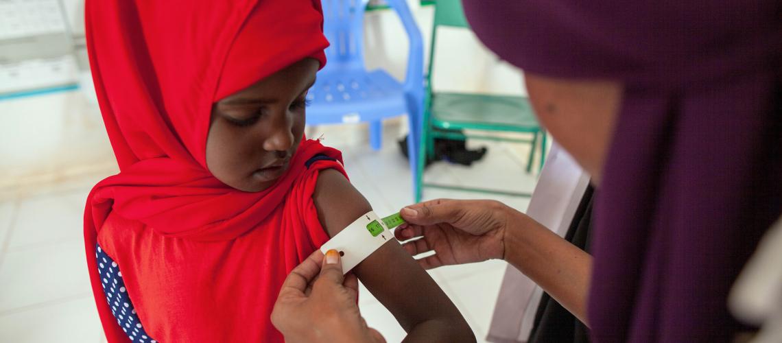 Young girl getting a measles shot