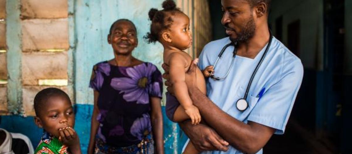 Doctor holding baby