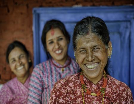 Three women smiling at the camera