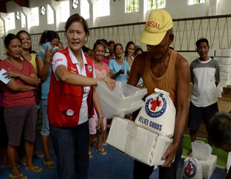 Humanitarian worker handing out resources