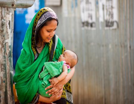 Woman holding a baby in her arms