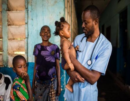 Doctor holding baby